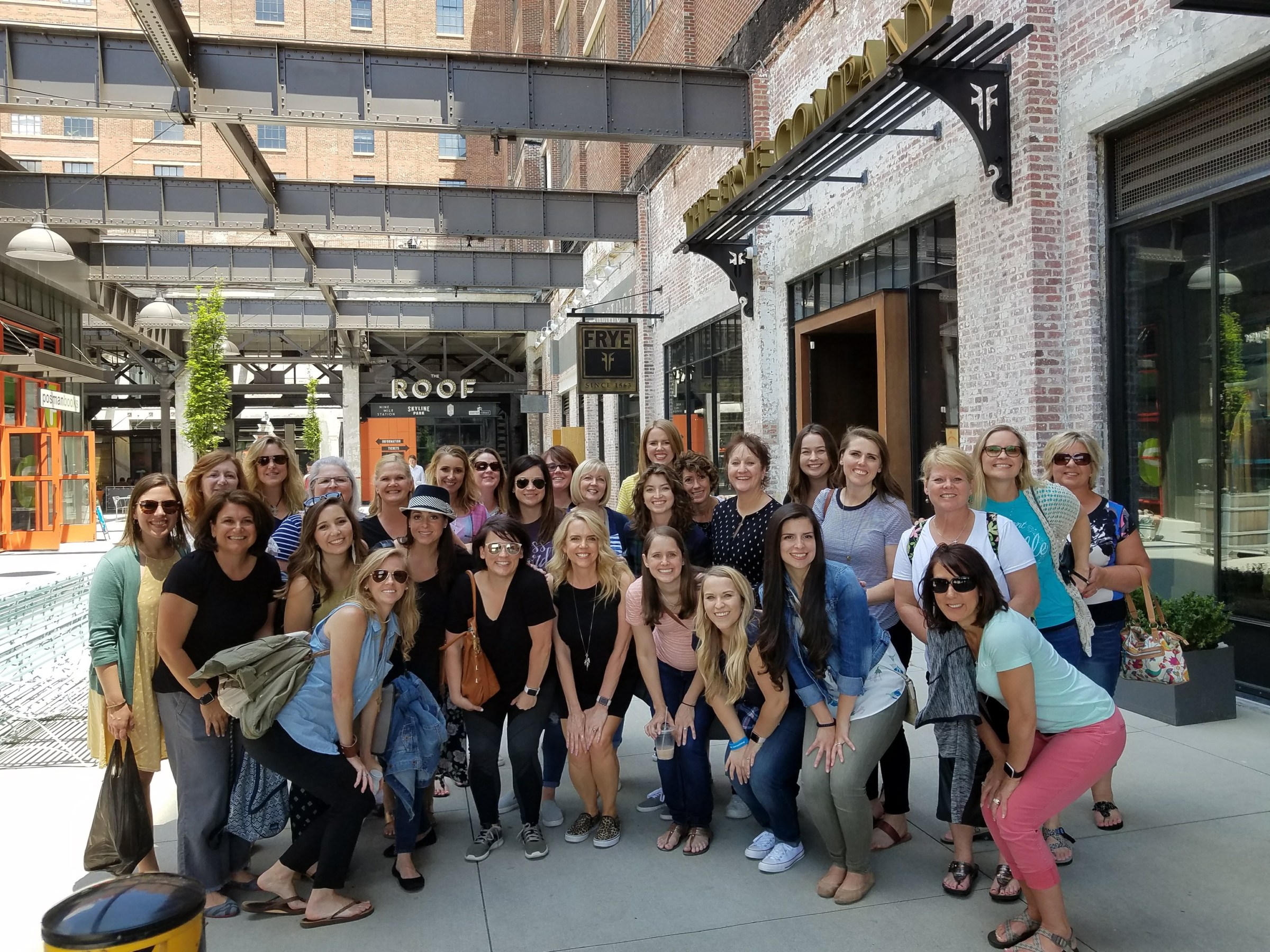 Katie Ellis et al. standing in front of a building