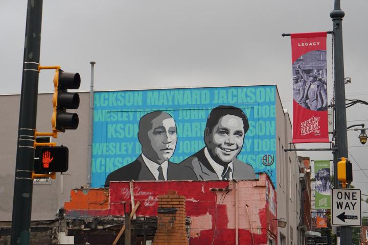 a person standing next to a traffic light