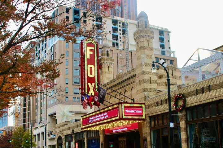 a building that has a sign on a city street