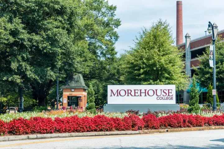 a sign in front of a house