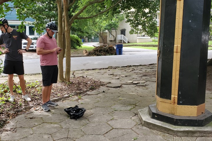 a group of people sitting around a fire hydrant