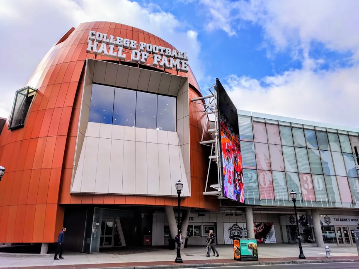 a train is parked on the side of a building