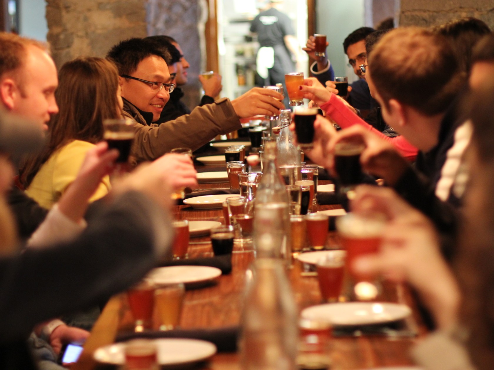 a group of people sitting at a table with wine glasses